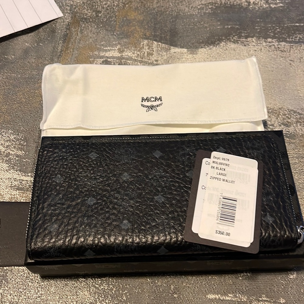 Brand New with tags and box MCM zip around black genuine leather wallet